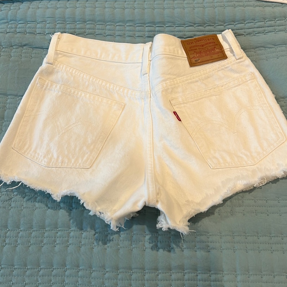 Levi’s white denim shorts.